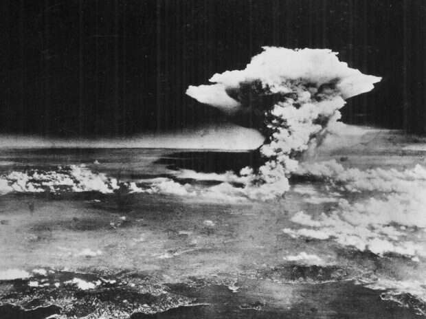 A mushroom cloud billows into the sky about one hour after an atomic bomb was detonated above Hiroshima, Japan.