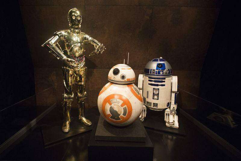 Characters C-3PO (L), BB-8 and R2-D2 (R) from Star Wars are pictured at the Discovery Store Times Square in Manhattan, New York November 11, 2015. REUTERS/Carlo Allegri